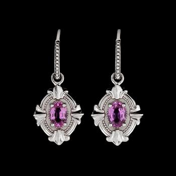 17. A pair of pink sapphire, circa 1.25 cts in total, earrings.