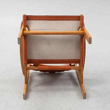 Carl-Axel Acking, a 'Trienna' oak and leather easy chair, mid 20th Century.