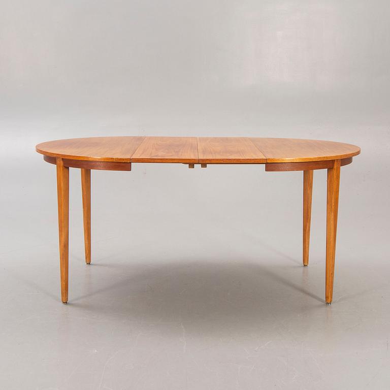 A 1960s teak dining table.