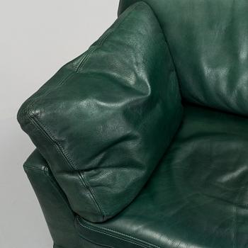 A "Fredrik" green leather sofa by Dux.