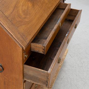 An oak secretaire, around 1800.