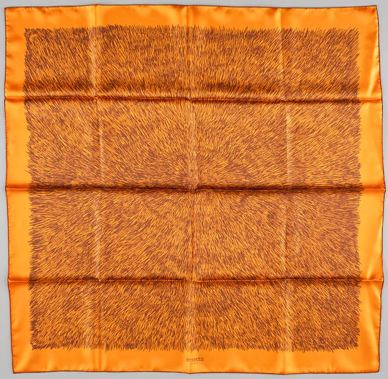 A silk scarf "Touch me" by Hermès.