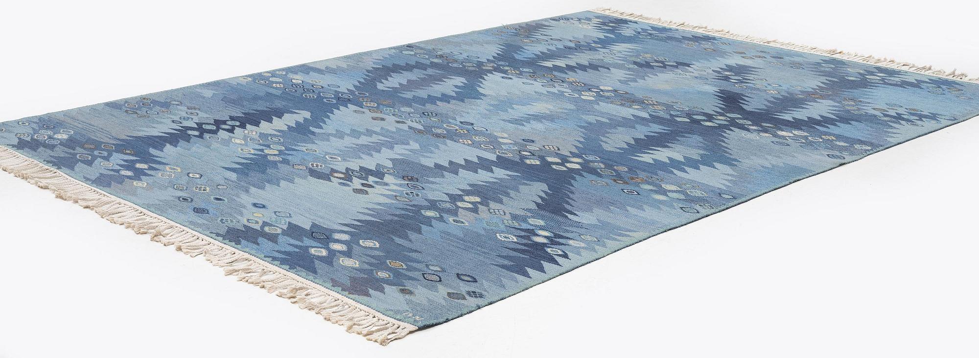 Barbro Nilsson, a carpet, 'Tånga mellanblå', flat weave, c. 350 x 252 cm, signed AB MMF BN.
