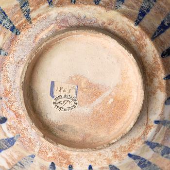 A cobalt glazed radila design pottery bowl, Persia (Iran), 12th/13th century.