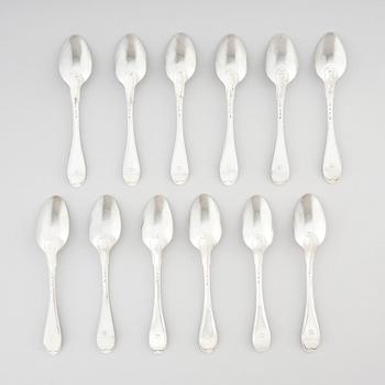 A set of twelve dessert spoons, silver, marks of Olof Hellbom, Stockholm 1800.