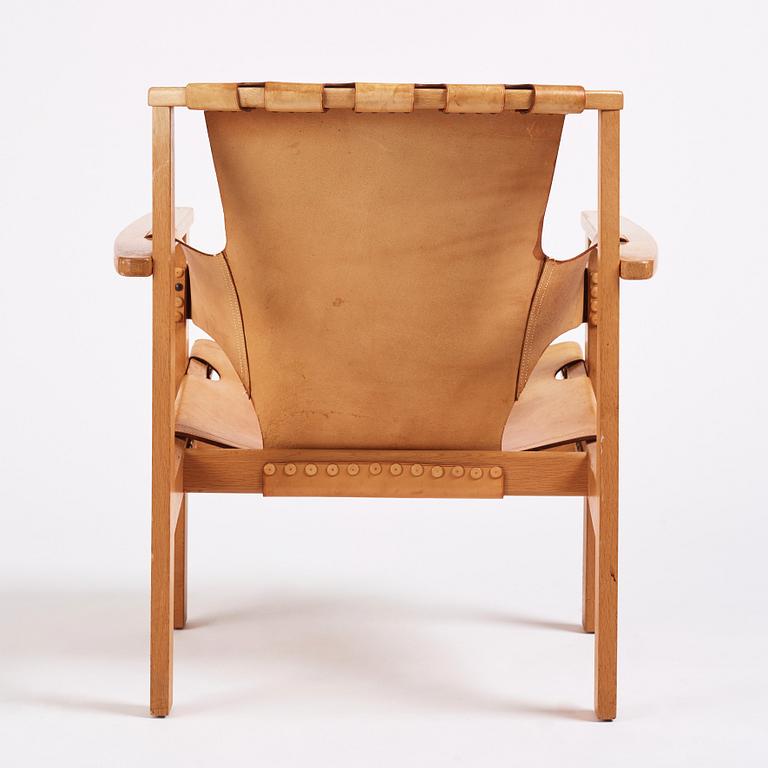 Carl-Axel Acking, a Swedish Modern oak and natural brown leather 'Trienna' chair, Nordiska Kompaniet.