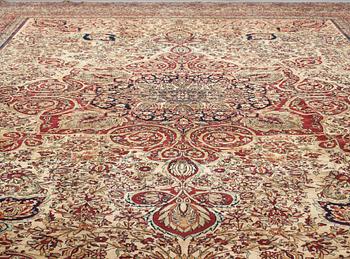 A carpet, an antique Kerman Laver, ca 677-688,5 x 510,5-526 cm.
