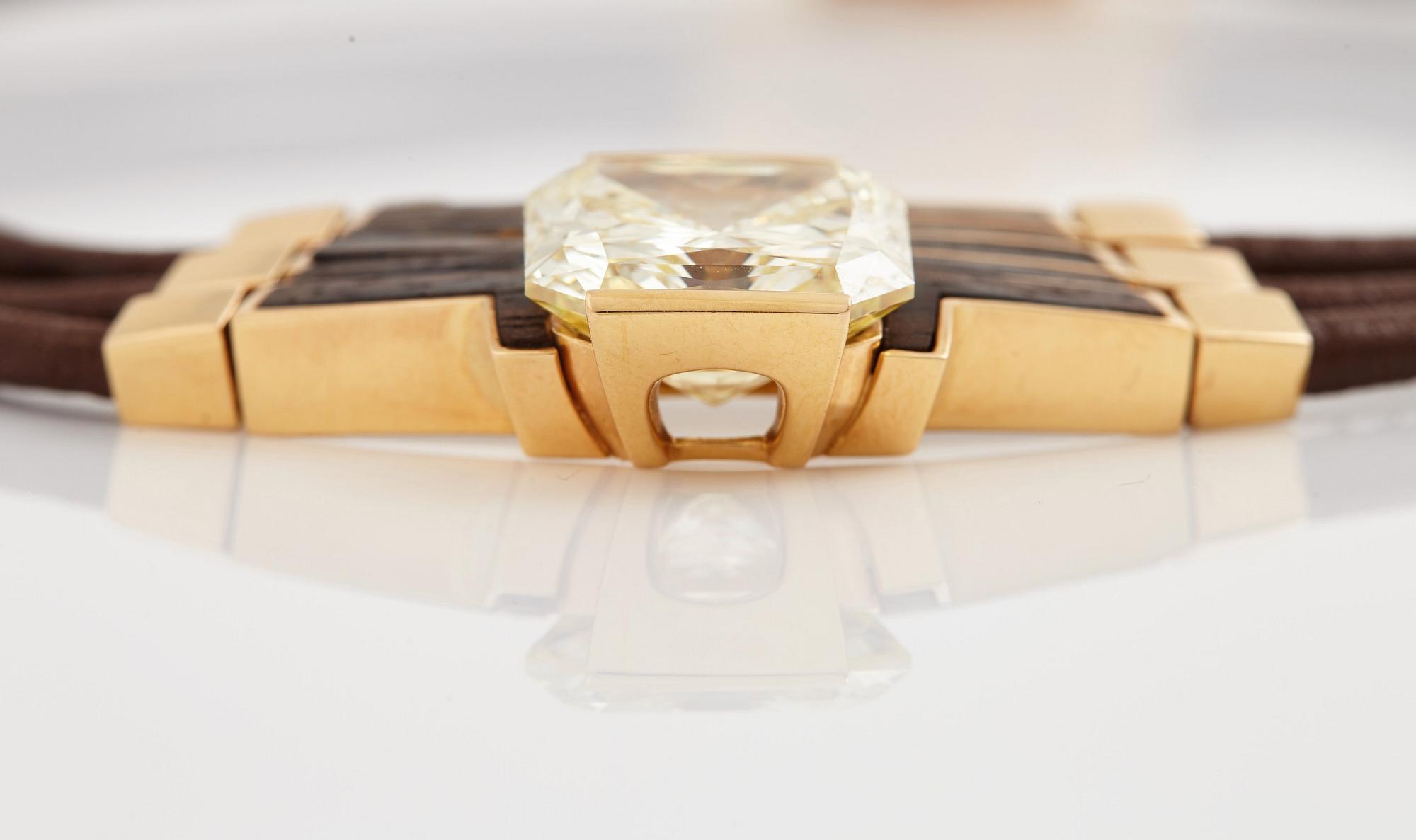 A Paul Binder necklace with a modified radiant-cut diamond ca 16 cts quality ca Fancy Light Yellow vs/si.