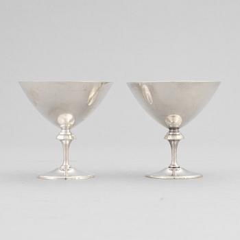 A silver plated shaker, C.G. Hallberg and a set of twelwe cocktail glasses, GAB, second half of the 20th Century.