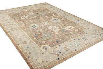 An Ushak design carpet, a. 423 x 305 cm.