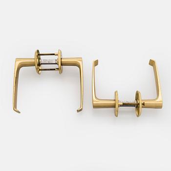 A set of eight 1960s-70s door handles.