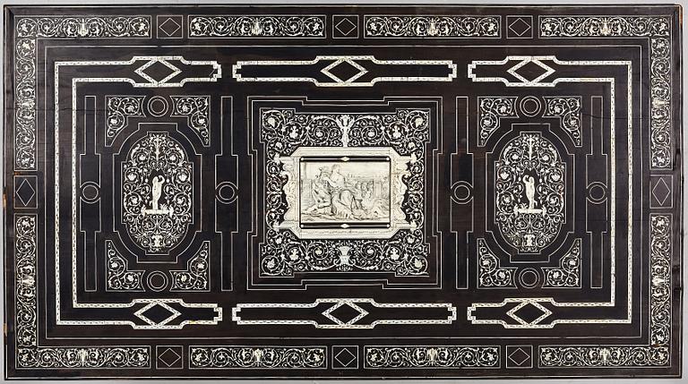 A Renaissance-style ebony, ebonized and ivory-inlaid library table, late 19th century, presumably Germany.