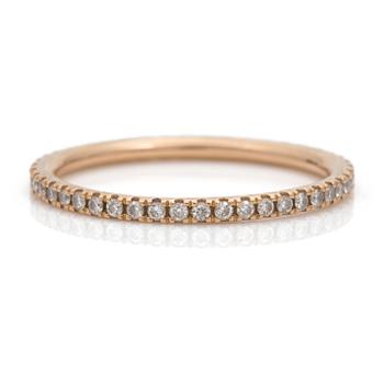 An eternity ring by Georg Jensen set with round, brilliant-cut diamonds.