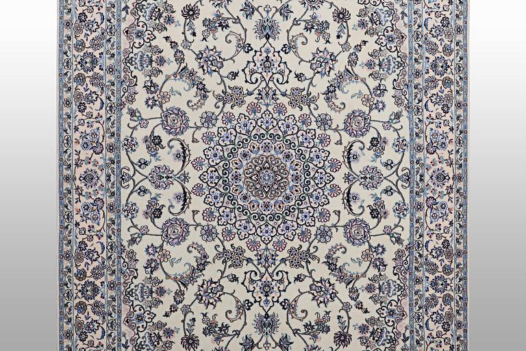 A Nain carpet, part silk, 6 laa, c. 250 x 160 cm.