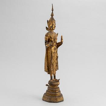 A Thai gilt bronze of standing Buddha Sakyamuni, 19th Century.