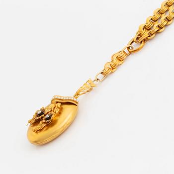 An 18K gold locket set with rose-cut diamonds and pearls with a chain.