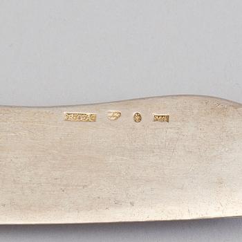A silver butterknife with porphyry shaft, dated 1853.