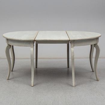 a two-part dining table from the mid 19th century.