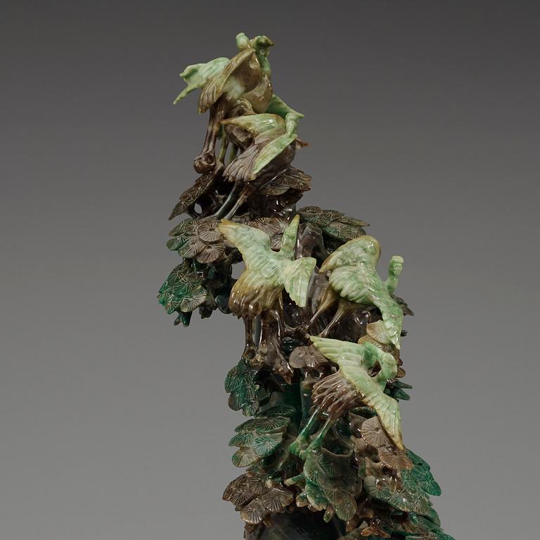 A large, Chinese carved jade pine tree with birds, 20th Century.