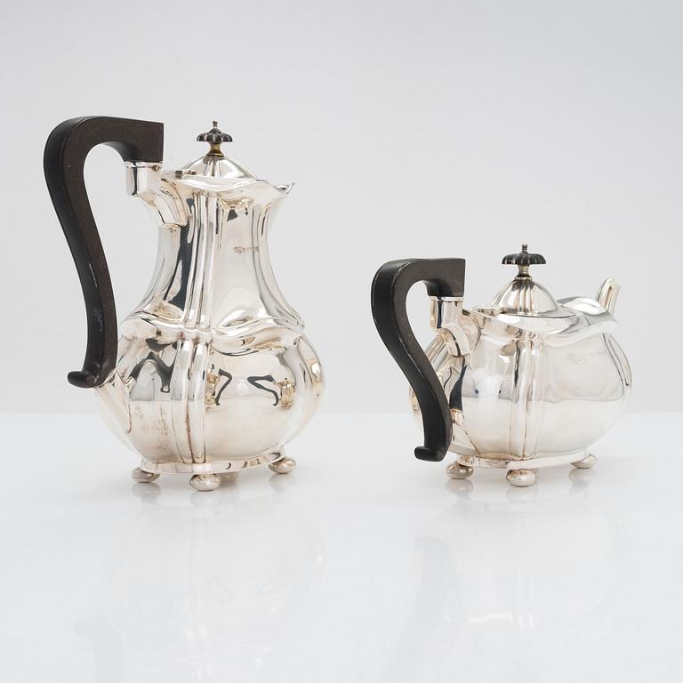 A four-piece sterling silver tea and coffee set, maker's mark of Joseph Gloster Ltd, Birmingham 1911, 1919 and 1922.