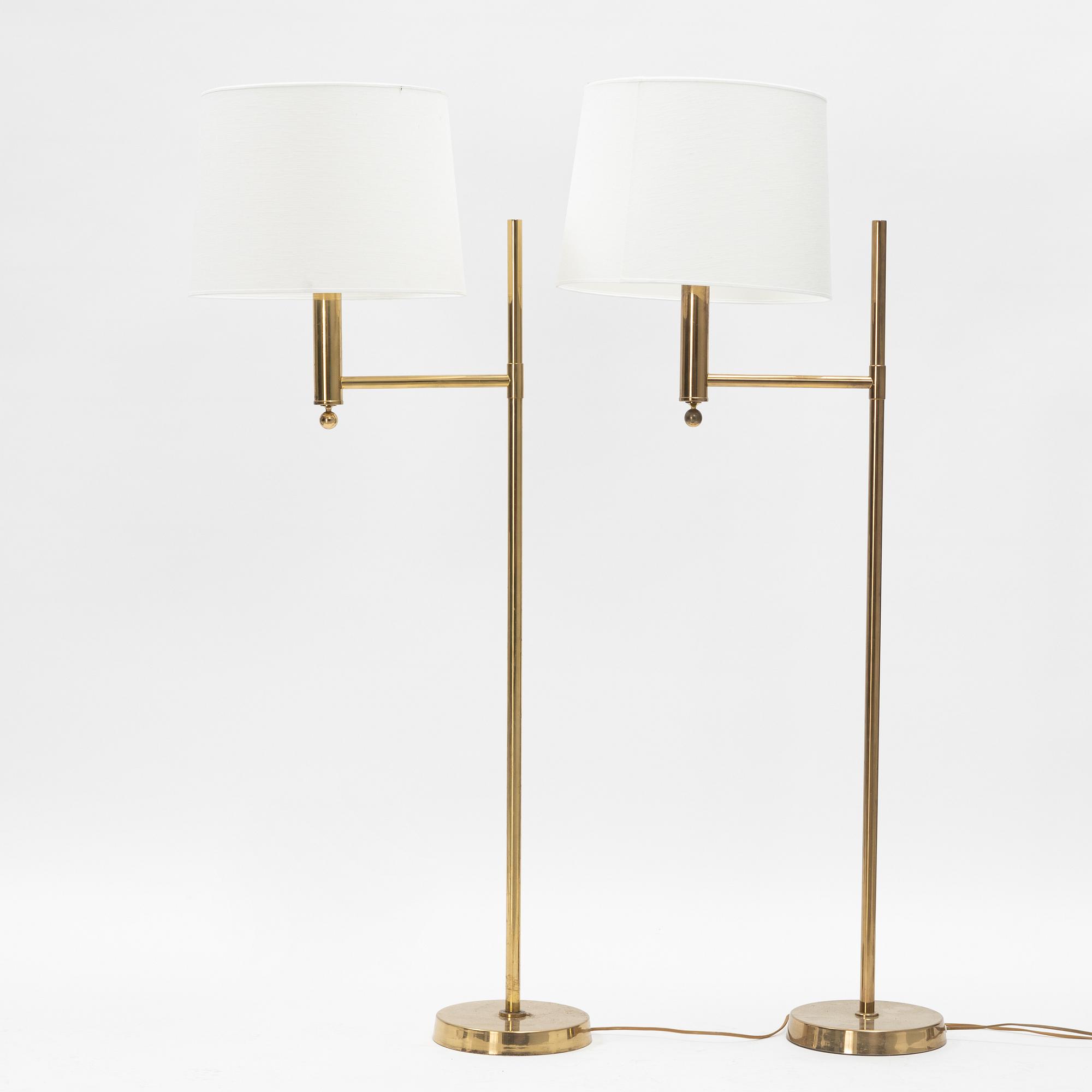 A pair of model 'G-18' brass floor lights, Bergboms, second half of the 20th Century.