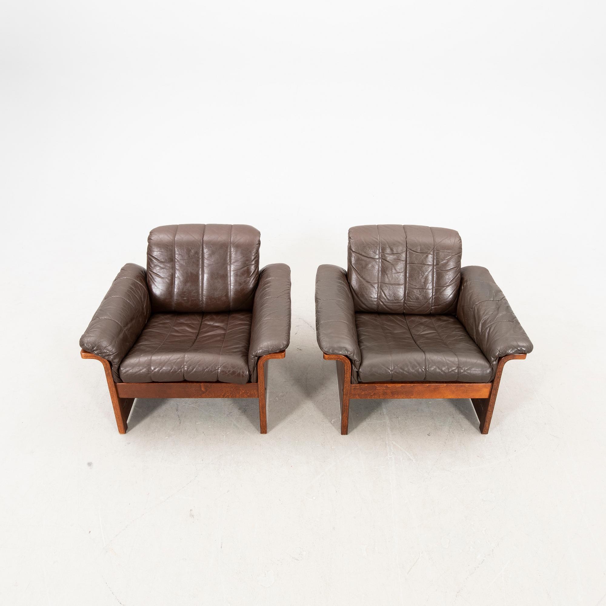A pair of 1970s leather armchairs.