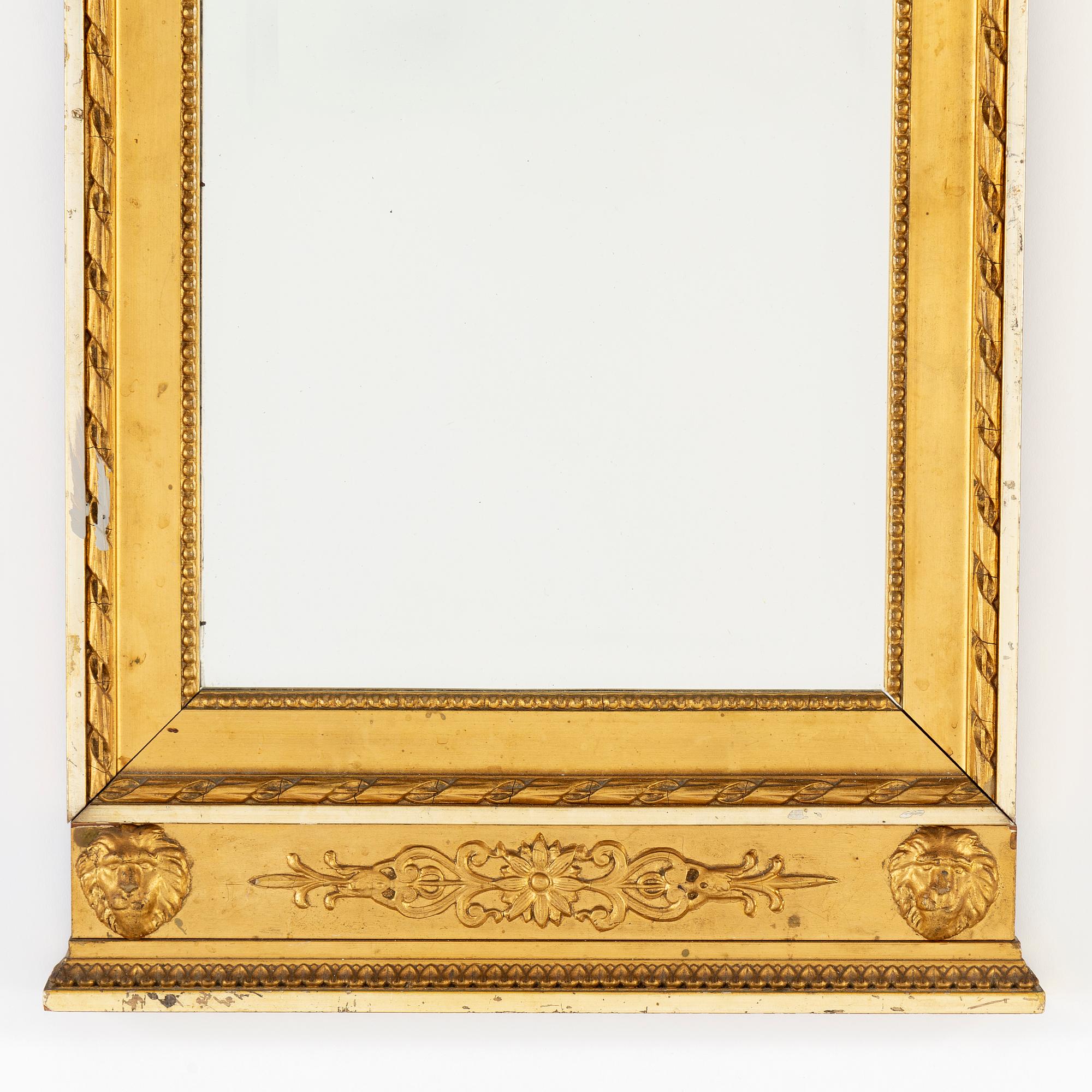A late gustavian style mirror, ca 1900.
