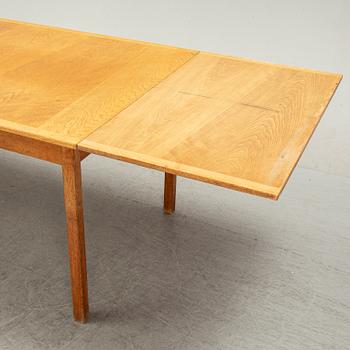 Knud Andersen, a set of six chairs for J.C.A Andersen, Aarhus, Denmark and a dinner table from Troeds, Bjärnum.