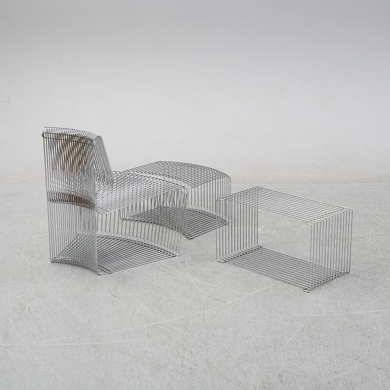 A 'Pantanova convex' chair with foot stool and a 'Wire Extendted' shelf, Verner Panton, Montana, Denmark.