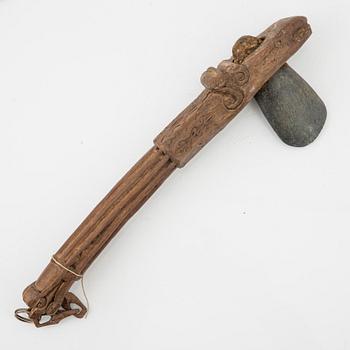 A set of three ceremonial Asmat axes and a sculpture object, Jakarta, Indonesia, 20th Century.