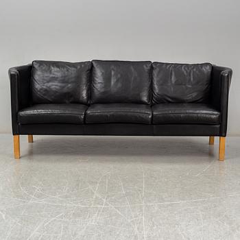 An 'AV59' sofa by Arne Vodder, Nielaus, Denmark.