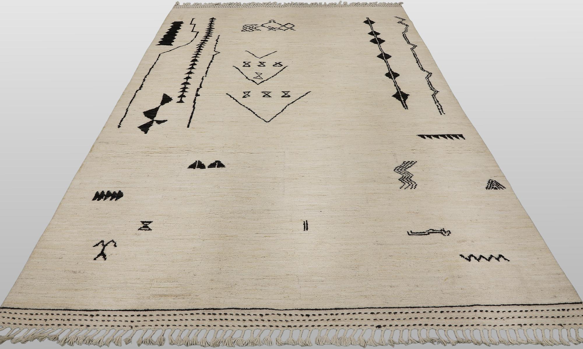 A Moroccan design carpet, c. 306 x 201 cm.