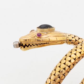 An 18K gold snake bracelet.