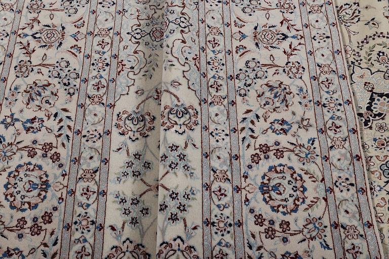 A carpet, Nain, part silk, ca 341 x 245 cm.
