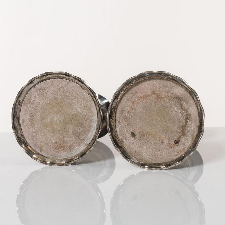 A pair of Baroque style silver candlesticks, marks of CG Hallberg, Stockholm 1942.