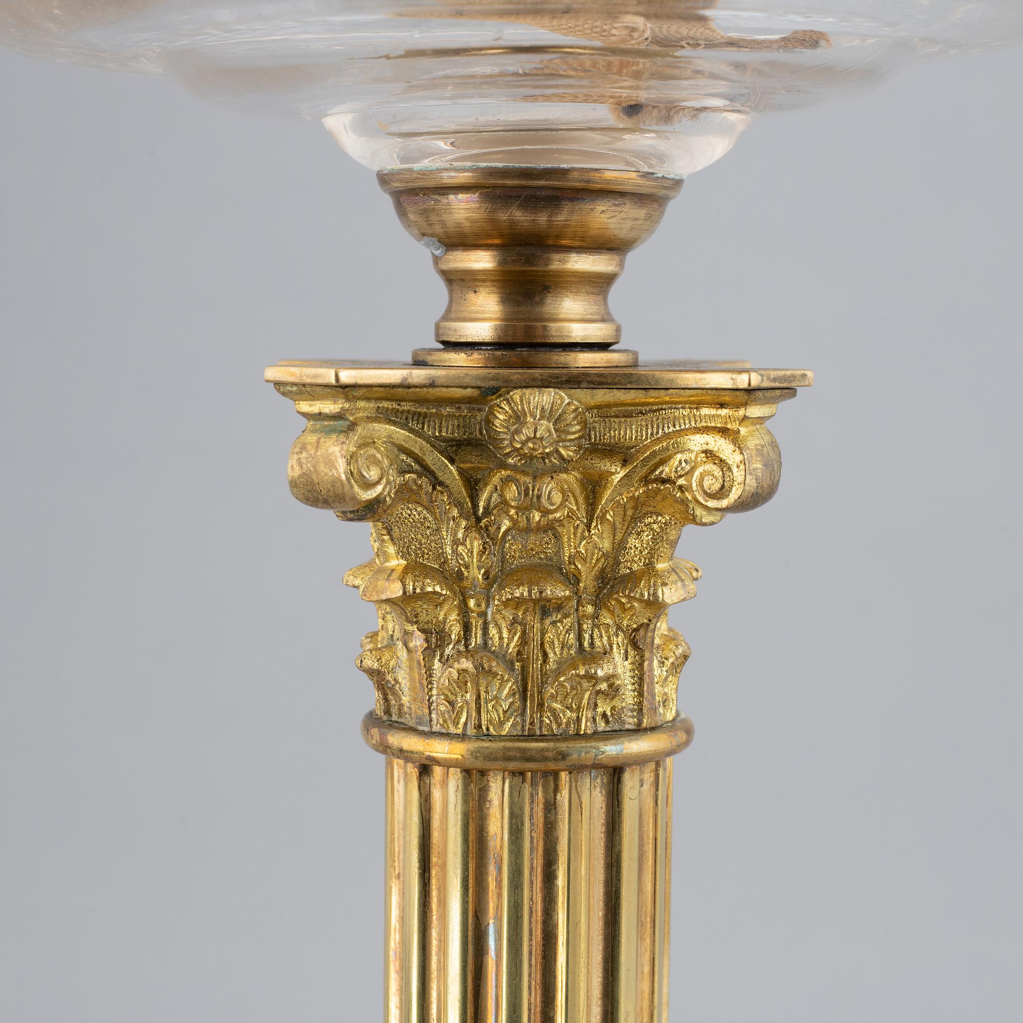 A brass oil lamp, ca 1900.
