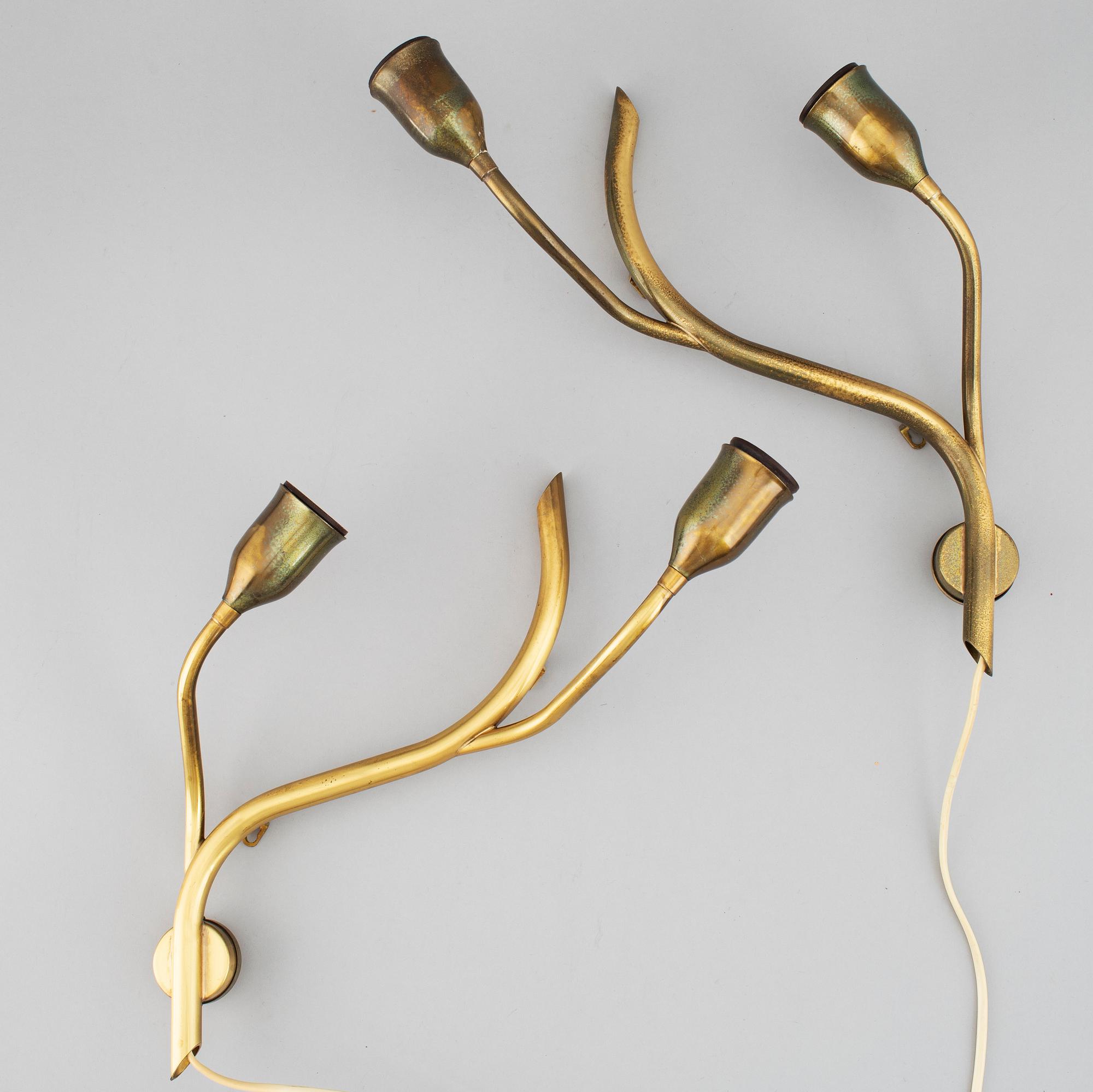A pair of Astra brass wall lamps, mid 20th century.