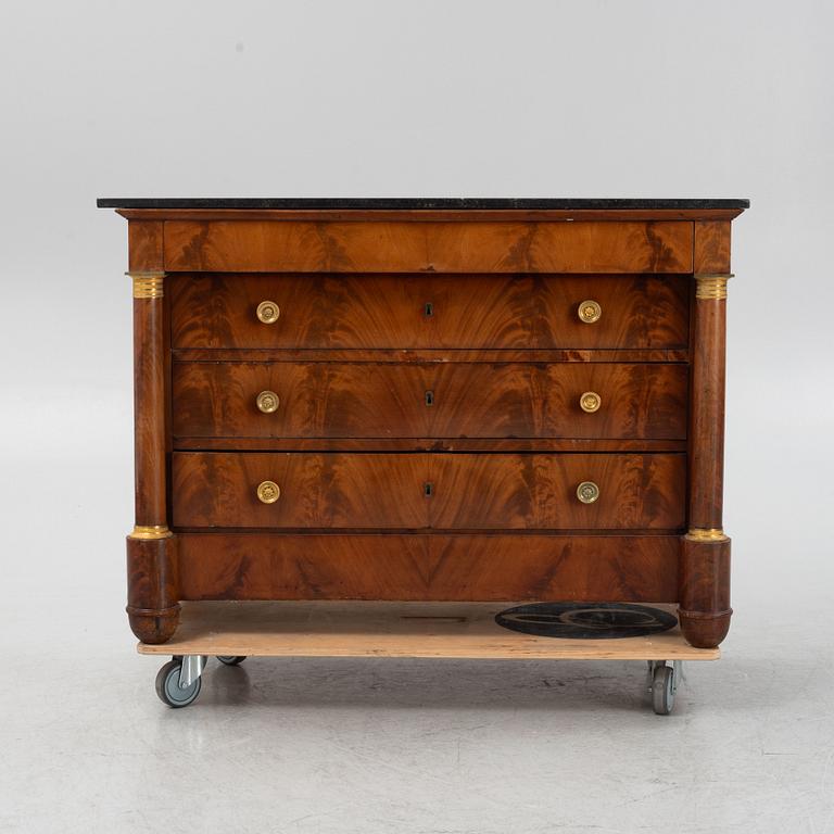 A French Empire mahogany and gilt brass mounted commode, early 19th century.