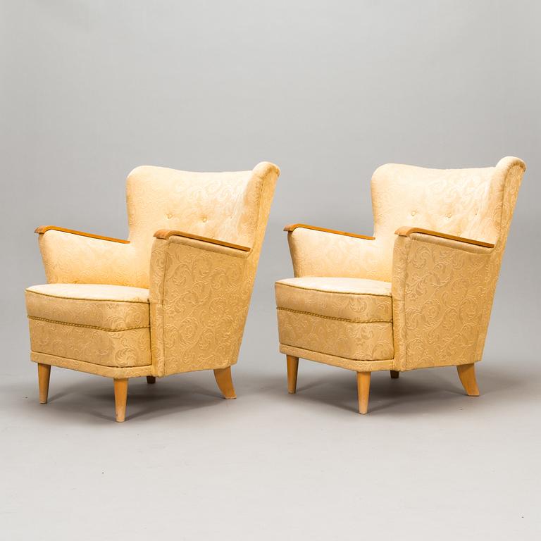 A pair of 1950's armchairs.