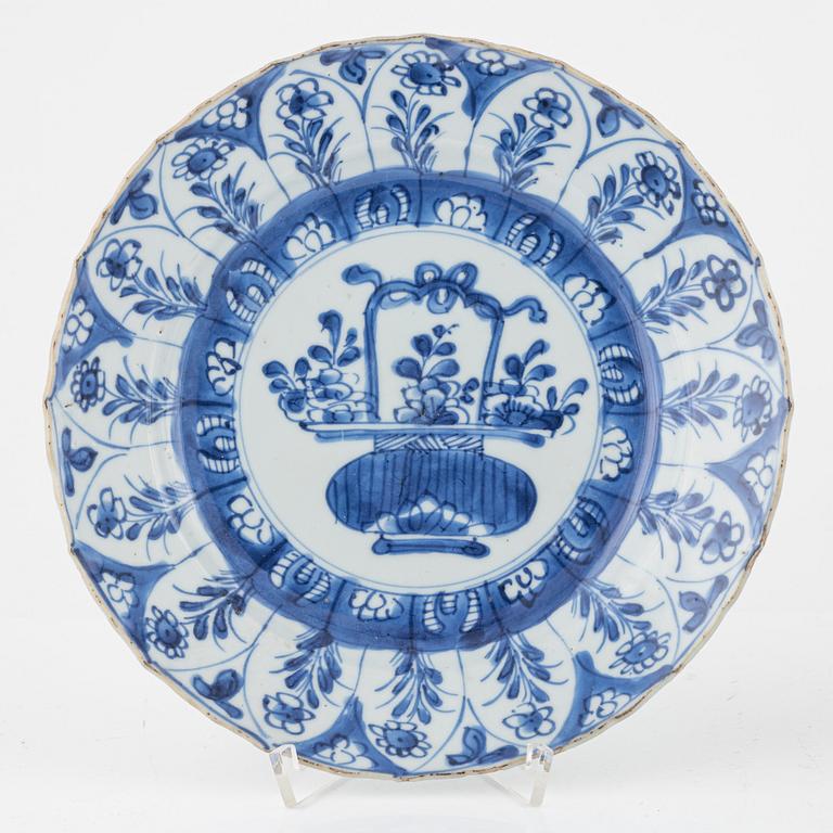 Three blue and white porcelain plates, Kangxi and Qianlong, 18th century.