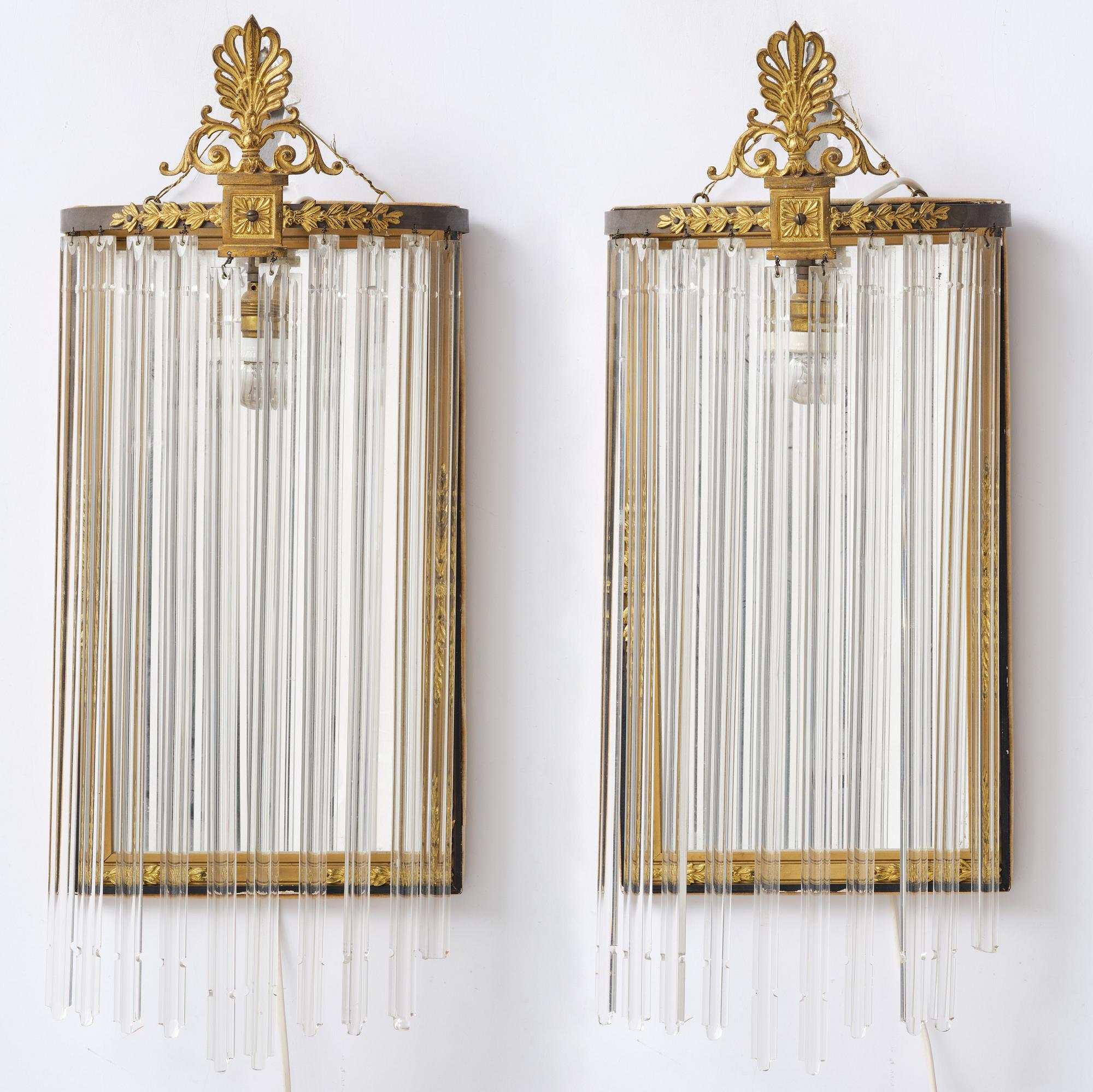 A pair of mirror sconces, 1910's/20's.