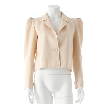 642. YVES SAINT LAURENT, a creme color silk jacket.