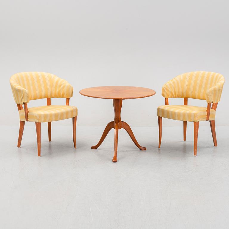 Carl Malmsten, a pair of 'Lata Greven' easy chairs, OH Sjögren, and a 'Berg' table, second half of the 20th Century.