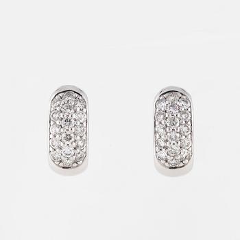 A pair of brilliant cut diamond earrings..