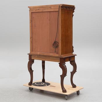 A Baroque style drinks cabinet, first half of the 20th Century.