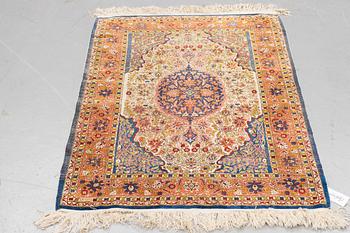 A rug, Old silk Hereke, ca 136 x 92 cm.