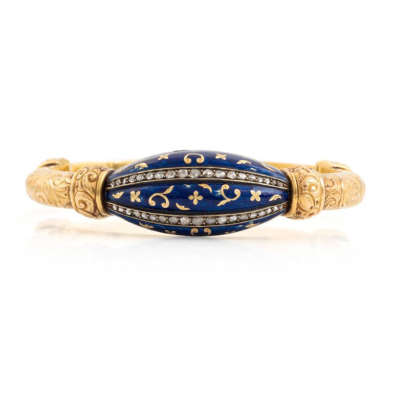 Armring, guld, blå emalj och rosenstenar.