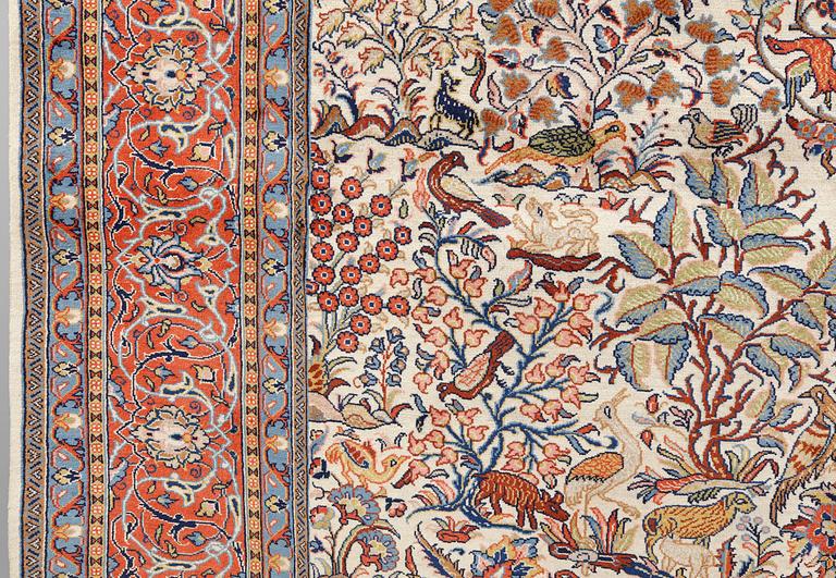 A figural Sarouk carpet, approx. 388 x 303 cm.