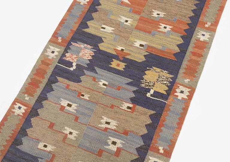 Märta Måås-Fjetterström, a carpet, 'Tolvbladsmattan', flat weave, c. 205 x 95 cm, signed MMF.