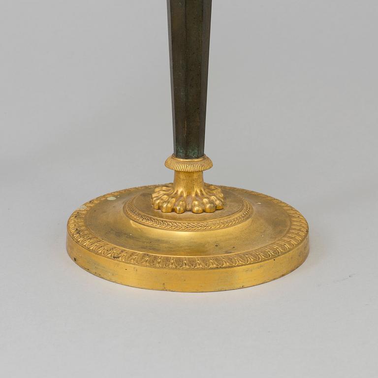 A pair of French Directoire late 18th century ormolu candelabra for three candles.